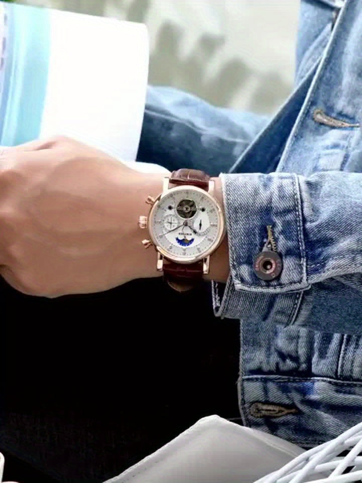KINYUED Orologio Meccanico Automatico da Uomo con Visualizzazione Sole, Luna e Stelle – Accenti in Oro Rosa, Cinturino Marrone Finto, Lancette Blu, Retro Trasparente, Regalo Perfetto per Lui