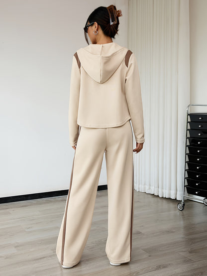 Top a maniche lunghe con cerniera per la primavera e pantaloni a gamba dritta, set casual a due pezzi con elegante cappuccio a blocchi di colore e vestito con coulisse per l'autunno